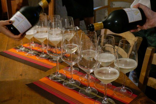 Pouring prosecco into glasses at Villa Sandi Winery