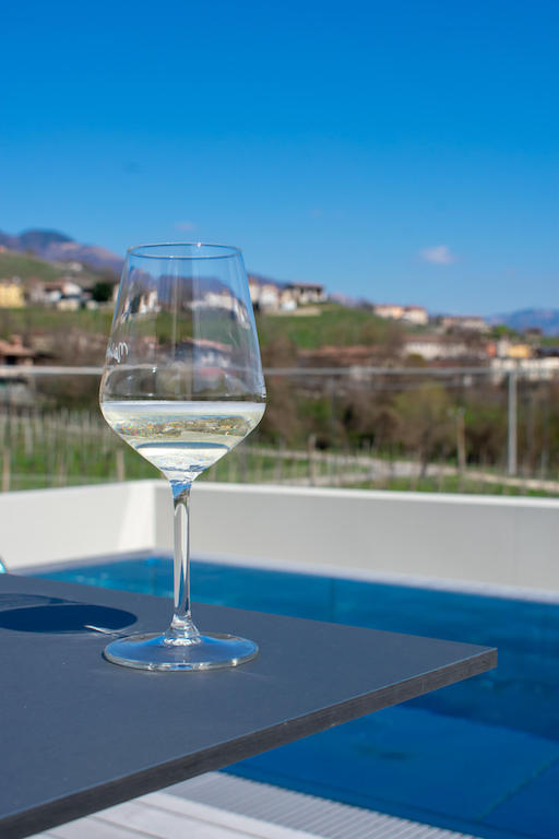 Nani Rizzi prosecco glass by the outdoor pool